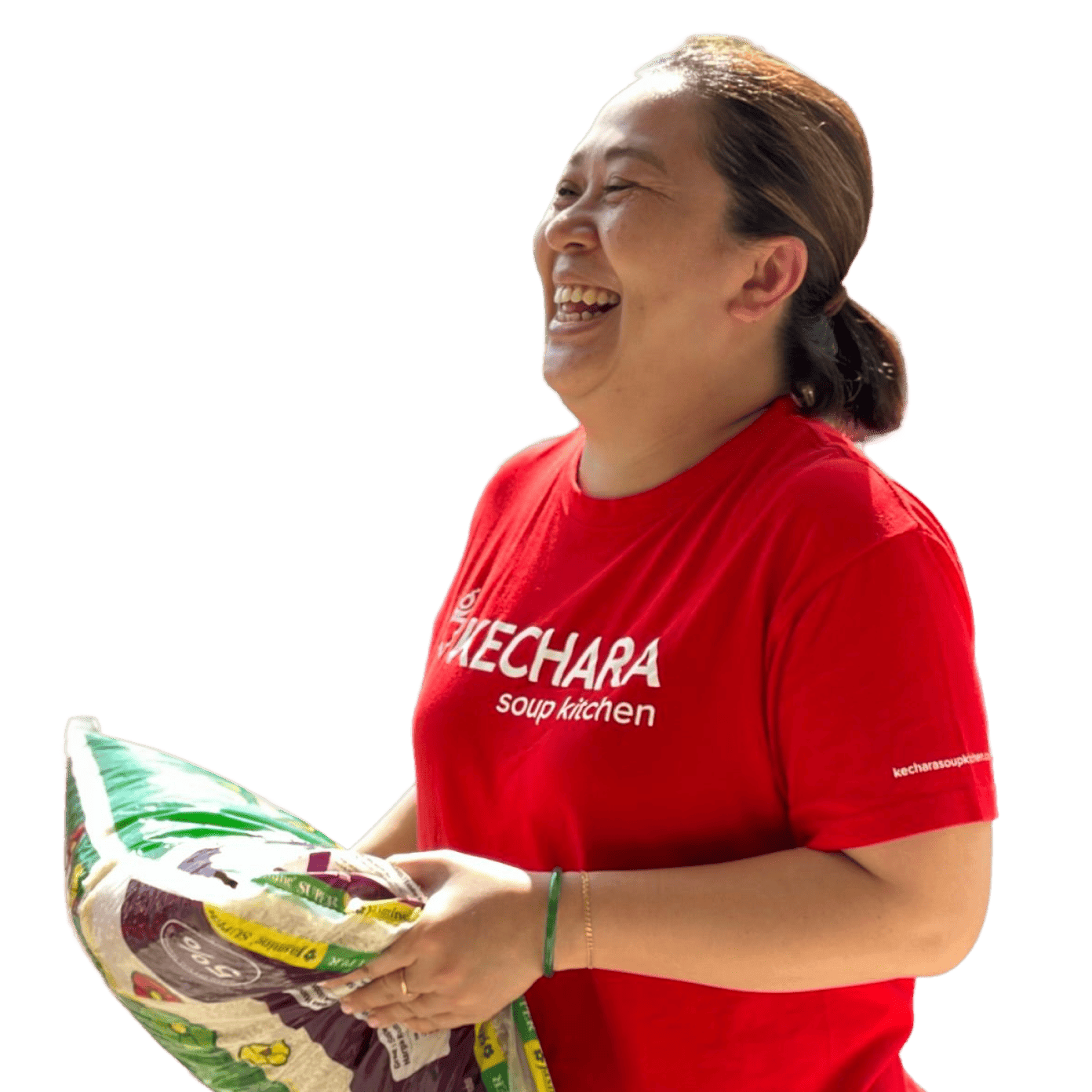A volunteer wearing KSK shirt holding a bag of rice