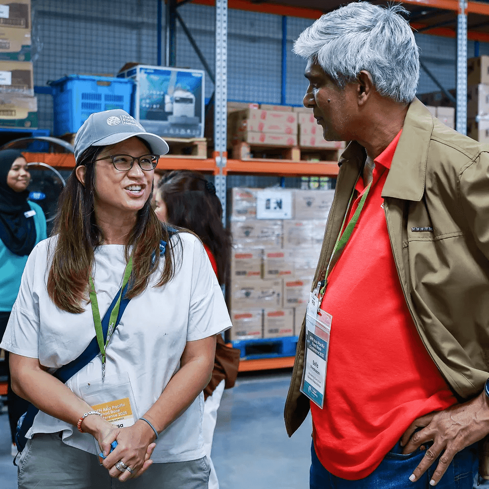 Two person having conversation during Global Foodbanking Network event